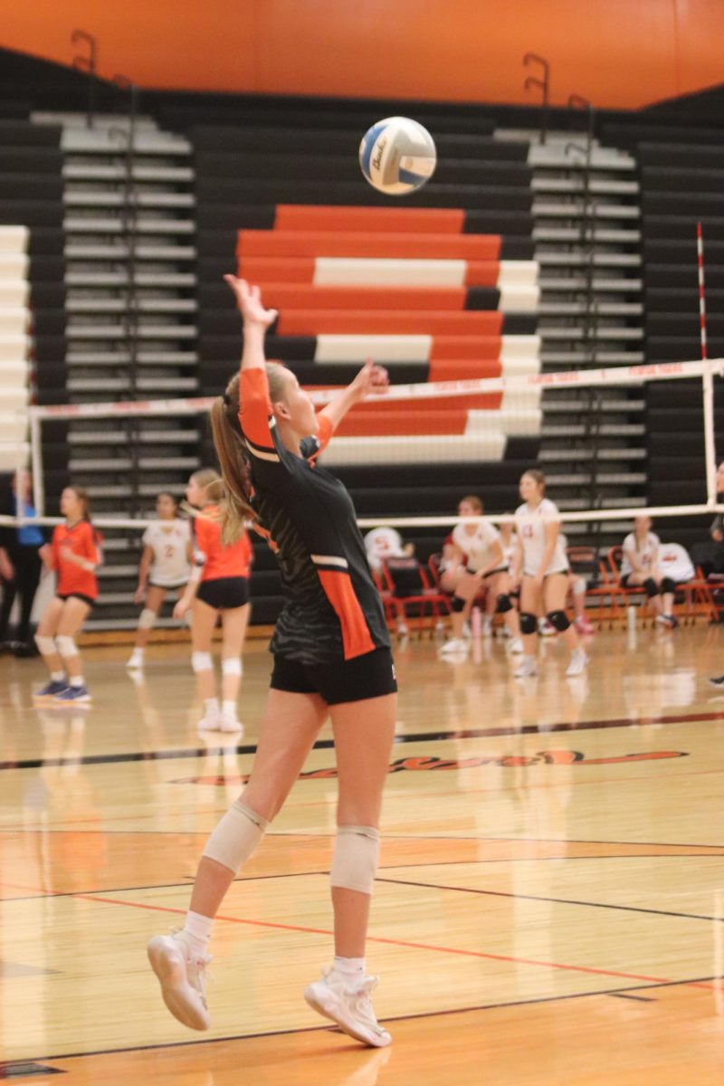 Serving, sophomore Charlei Peabody serves the ball over to Swartz Creek. On Oct 15, Fenton played Swartz Creek and took the win 3-0.