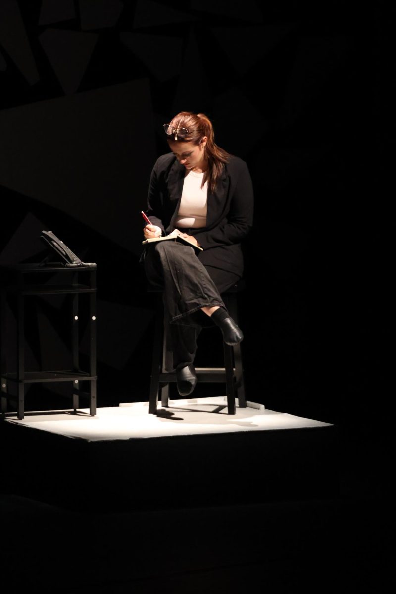 Performing in front of an audience, junior Norah Stickel acts in the school play. On Oct. 3, FHS put on their big fall play called Trap.