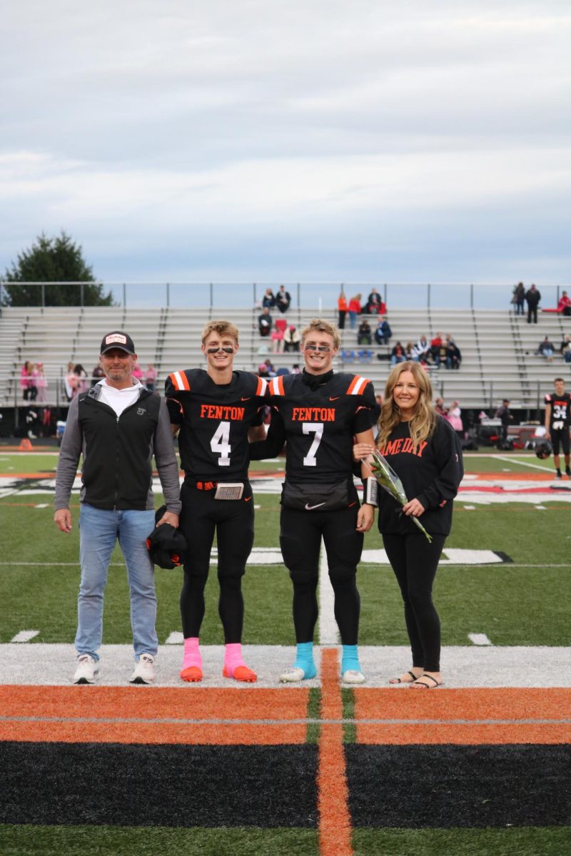 Smiling, seniors Rory and Noah Sheil were accompanied by their parents. On Oct. 10, FHS had senior night before the football game against Linden.  