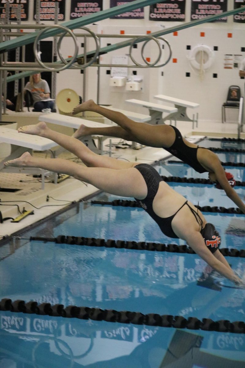 Diving into the pool, sophomore Isabella Murto takes off for her race. On Oct. 14, the girls swim and dive team placed second in their tri meet against Grand Blanc and Powers High School. 