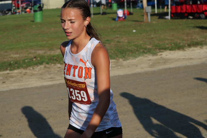 Recovering from her race, sophomore Lucy Bott ran in the Cummin Center Invitational cross country race. On Oct. 4, Fenton girls varsity cross country team placed 16-23.