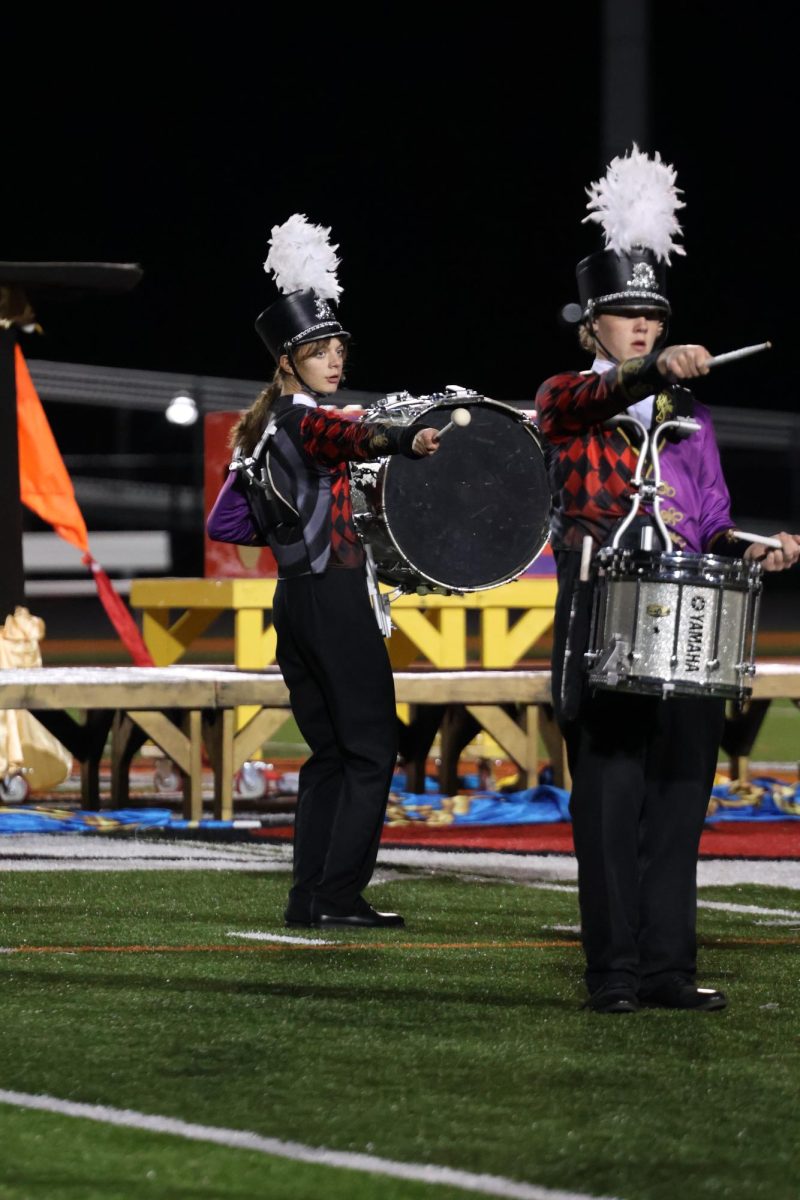 Pointing, sophomore Grace Wolner and William Corry put on their last performance. On Oct. 29, the FHS marching band performed for state's sendoff.
