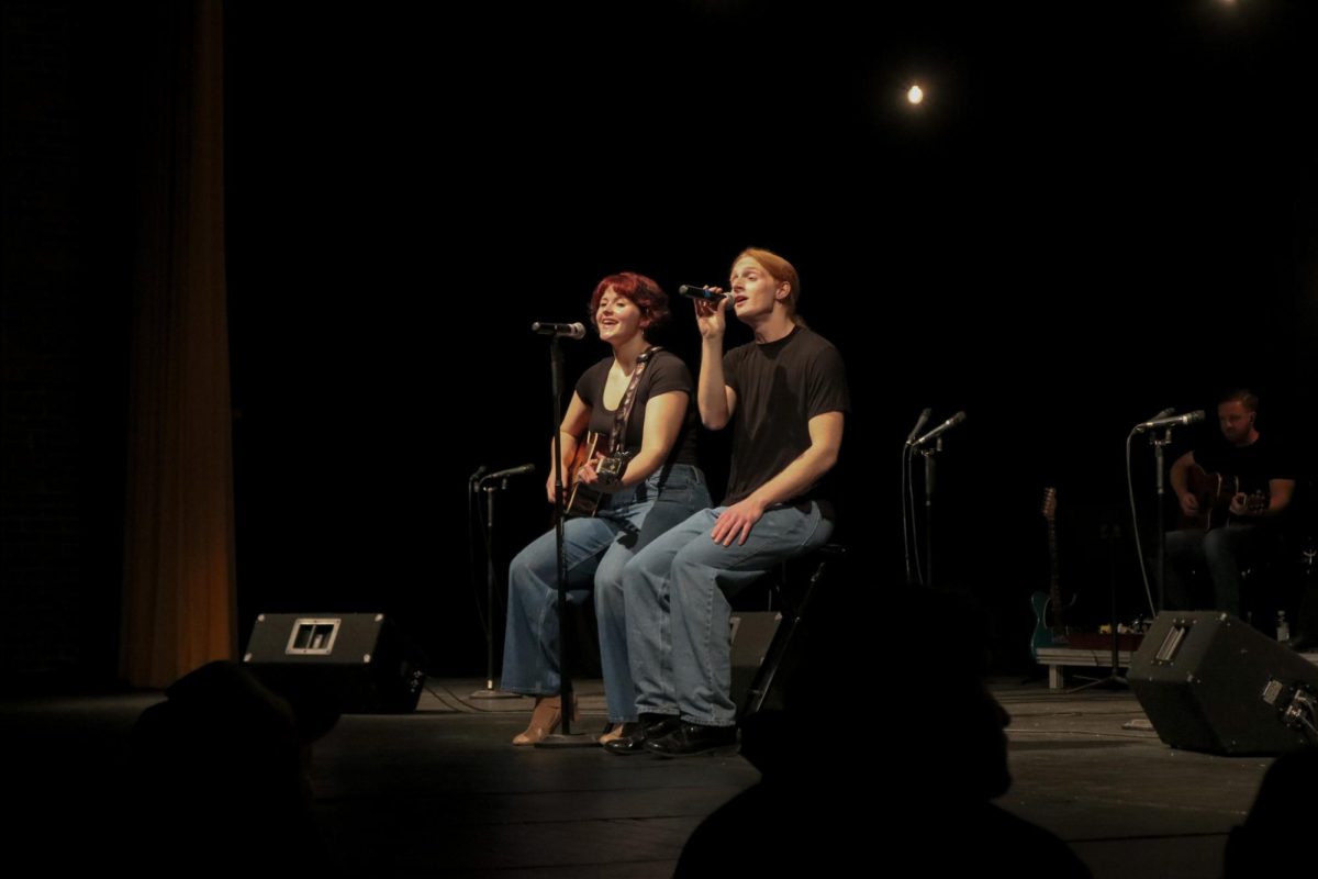 Singing a duet, Seniors Millie Grasso and Ash Holmes perform a duet of their favourite Beatles song. On Nov. 15, the Fenton ambassadors perform their sneak peek preview concert in the auditorium. 
