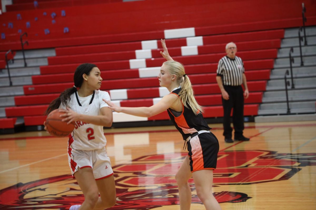 Guarding the ball, Freshman Jada Conrady prevents the other team from passing. On Dec. 12, girls JV Fenton basketball defeats Swartz Creek 29-14.
