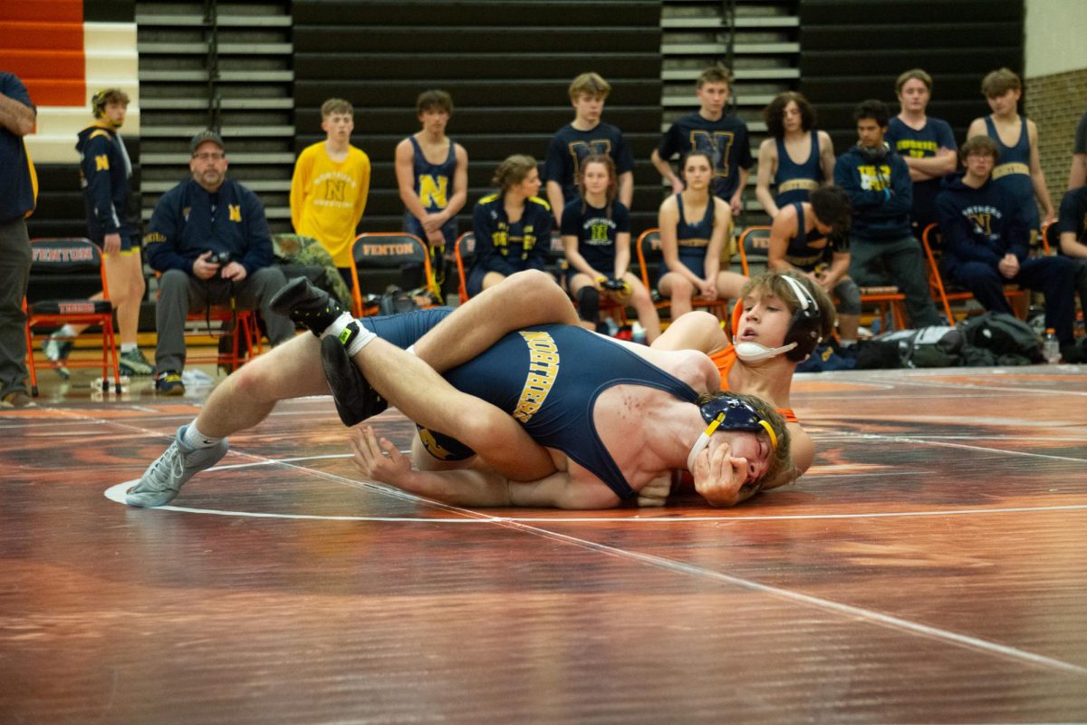 Pinning his opponent, Freshmen Gage Turnbloom wrestles his competitor. On Dec. 3 Fenton wrestling goes against Northern high school.