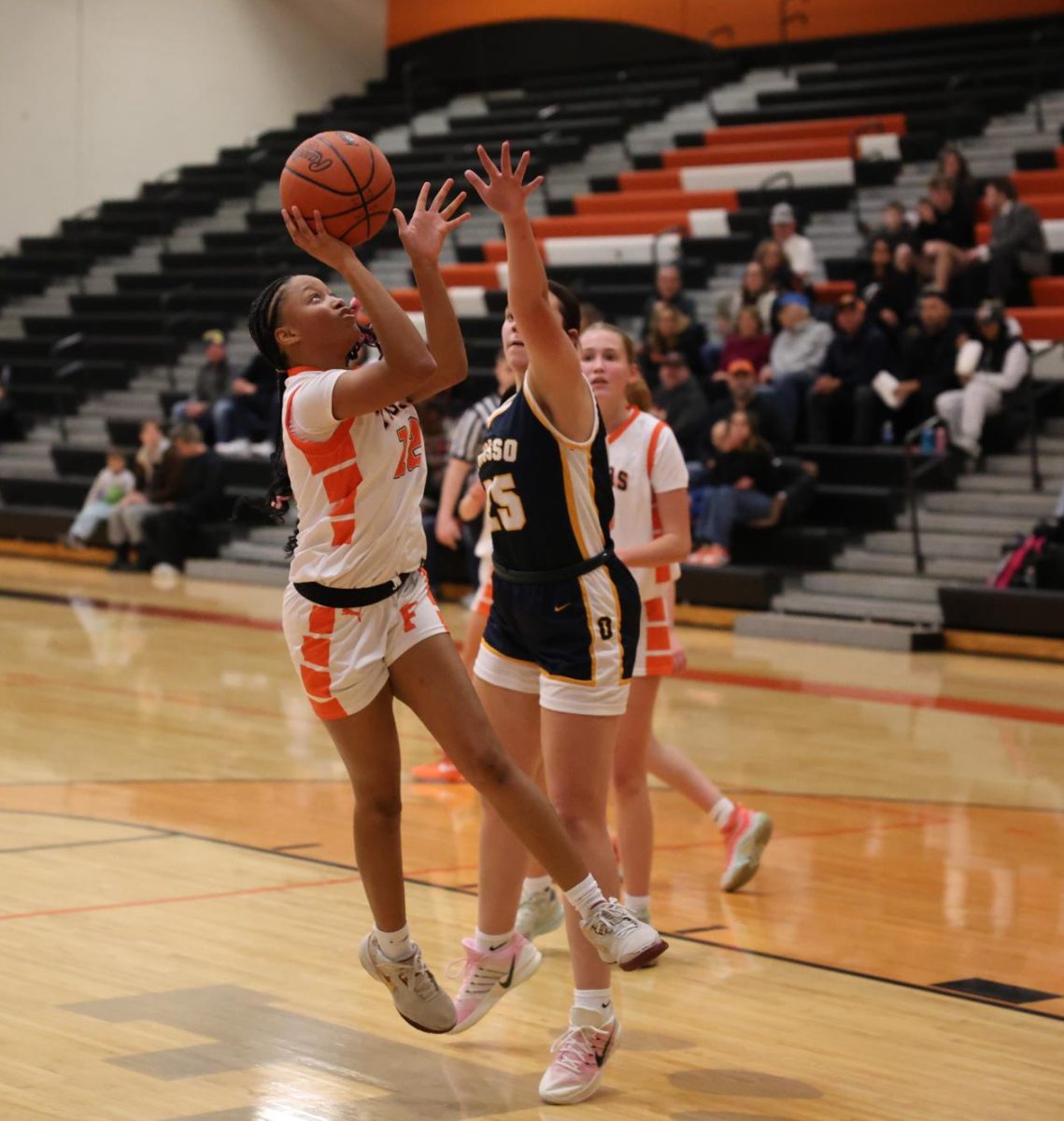 Shooting the ball, senior Kierstyn Rutley makes a layup. On Dec. 9, the FHS girls varsity basketball team played Owosso, winning 47-43.
