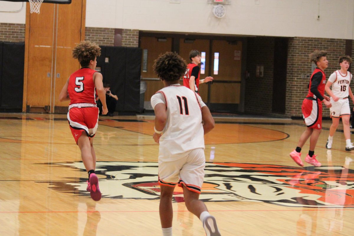 Running up the court, sophomore Traeh Hawkins trying to get open for his team. On Dec. 16 the JV Boys had a game vs Swartz Creek.
