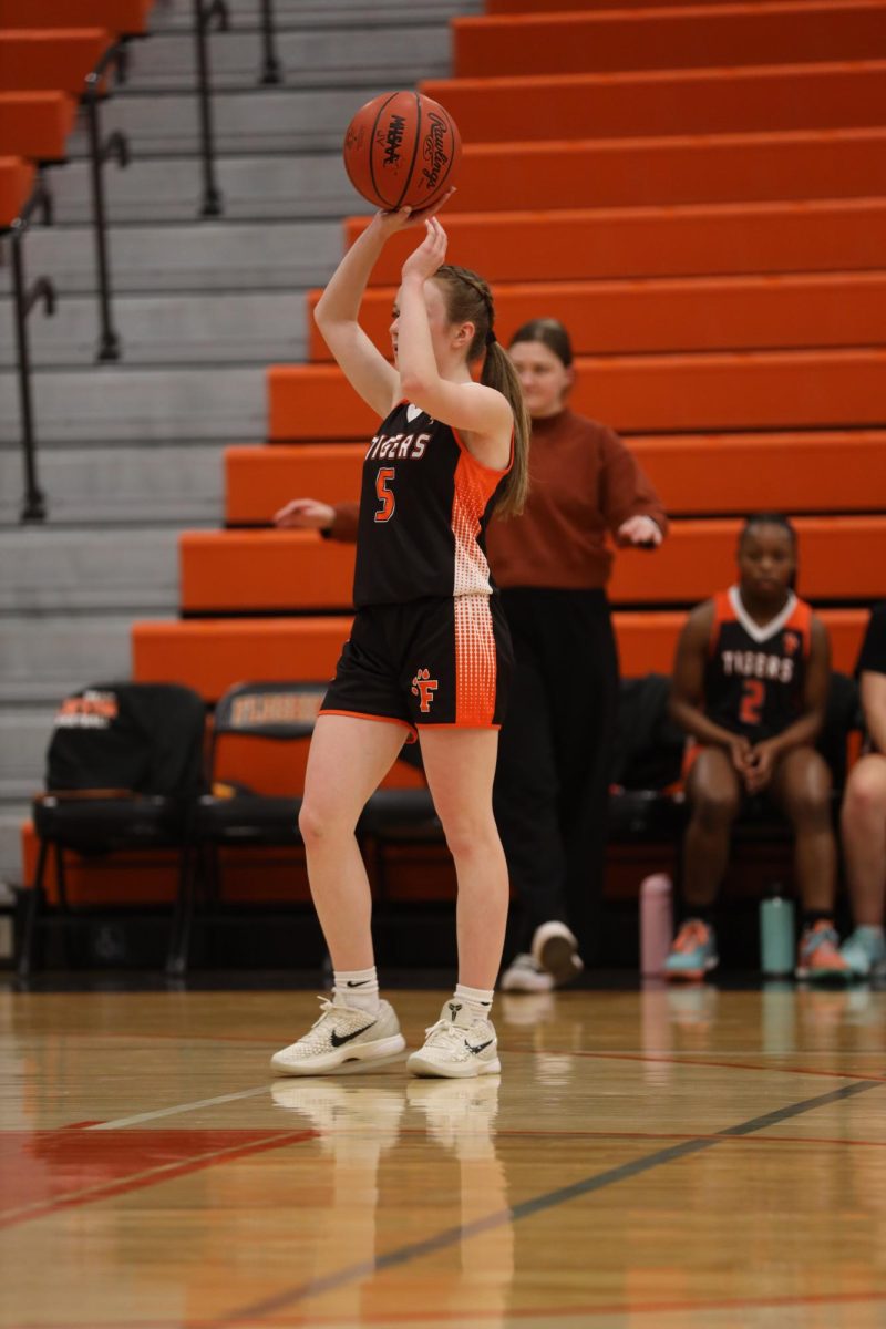 Passing the ball, freshman Monroe Lafontaine throws the ball to a teammate. On Jan 16, Fenton JV girls Basketball takes on girls JV Flushing team.