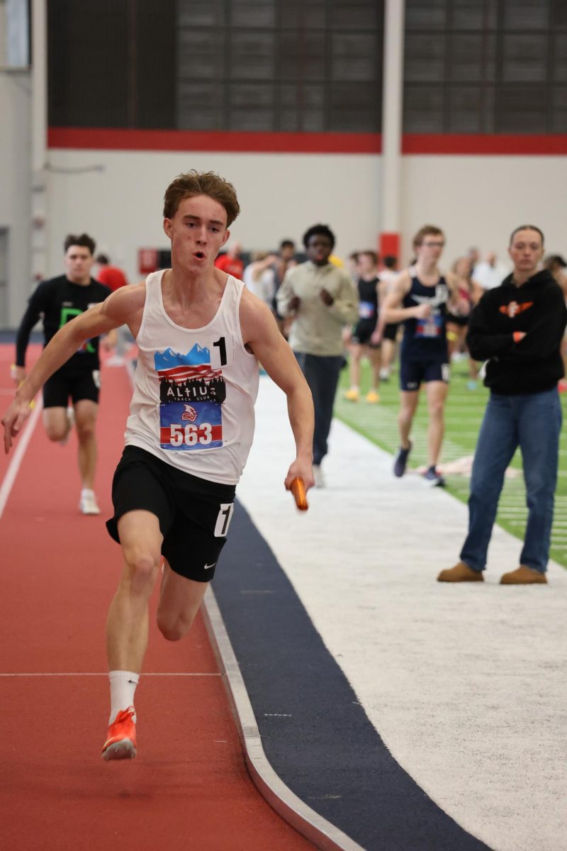 Sprinting the straight-away, sophomore Micheal Smith races at SVSU indoor track meet. On Jan. 17, the indoor track team went to Saginaw Valley to get ready for the outdoor season. 