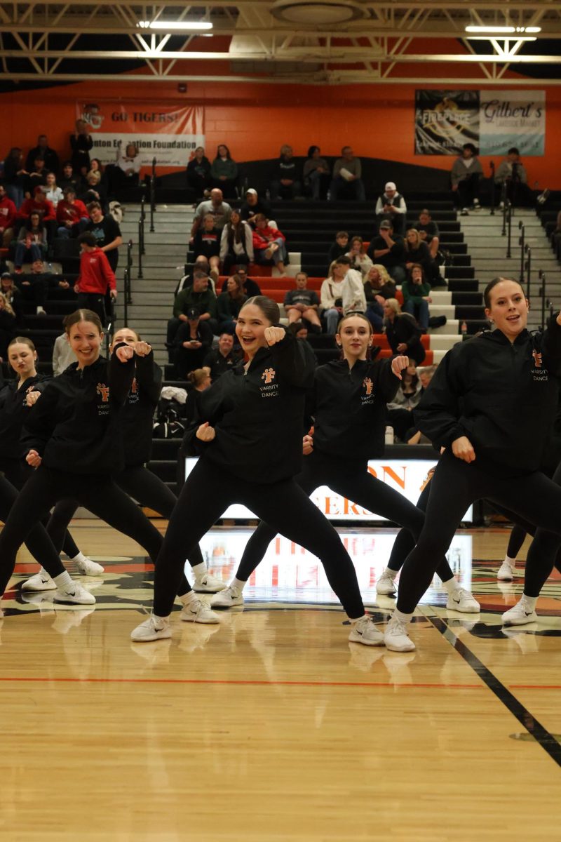 Front in center, senior Kennedy Walrath performs at the halftime show. On Jan 9 the varsity dance team performed during the boys' varsity basketball game against Linden. 
