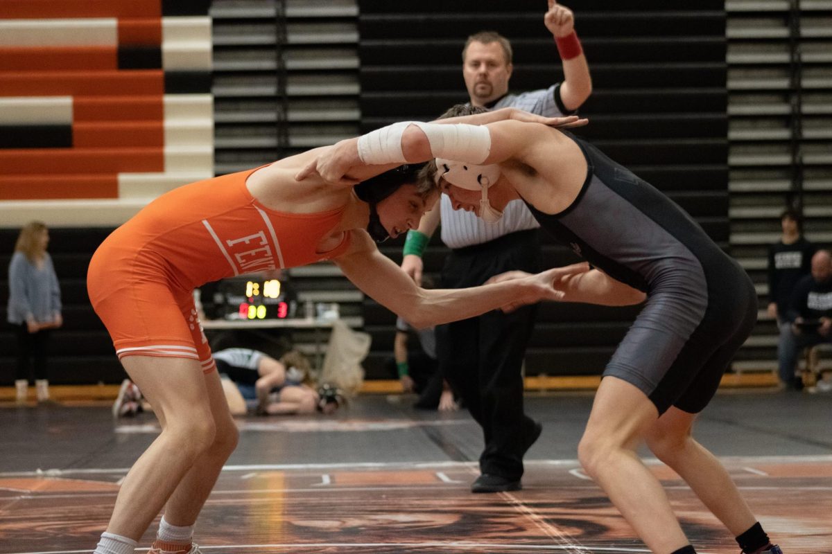 Grabbing his opponent, sophomore Henry Golembiewski tries to take down his opponent.  On Jan. 24, Fenton goes against Grand Rapids.