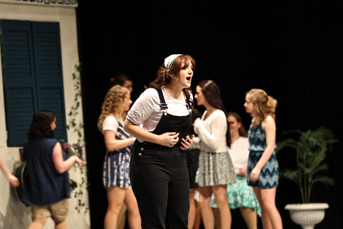Singing to the crowd, junior Norah Stickel acts her part in the play. On Feb. 5, FHS had their opening night of their musical production Mamma Mia.