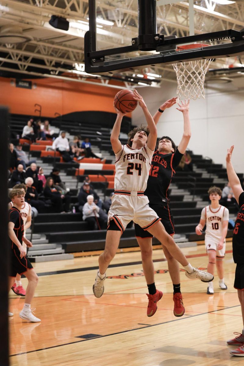 Looking at the net, sophomore Deton Thommen attempts to make a basket. On Feb. 5, the Fenton junior varsity basketball team played Linden and lost 42-53.

