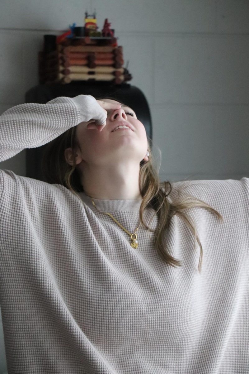 Touching her nose, senior Marlee Topij completes a series of drunk tests. On Feb. 2, Matt Sullivan’s forensics class did field sobriety testing.
