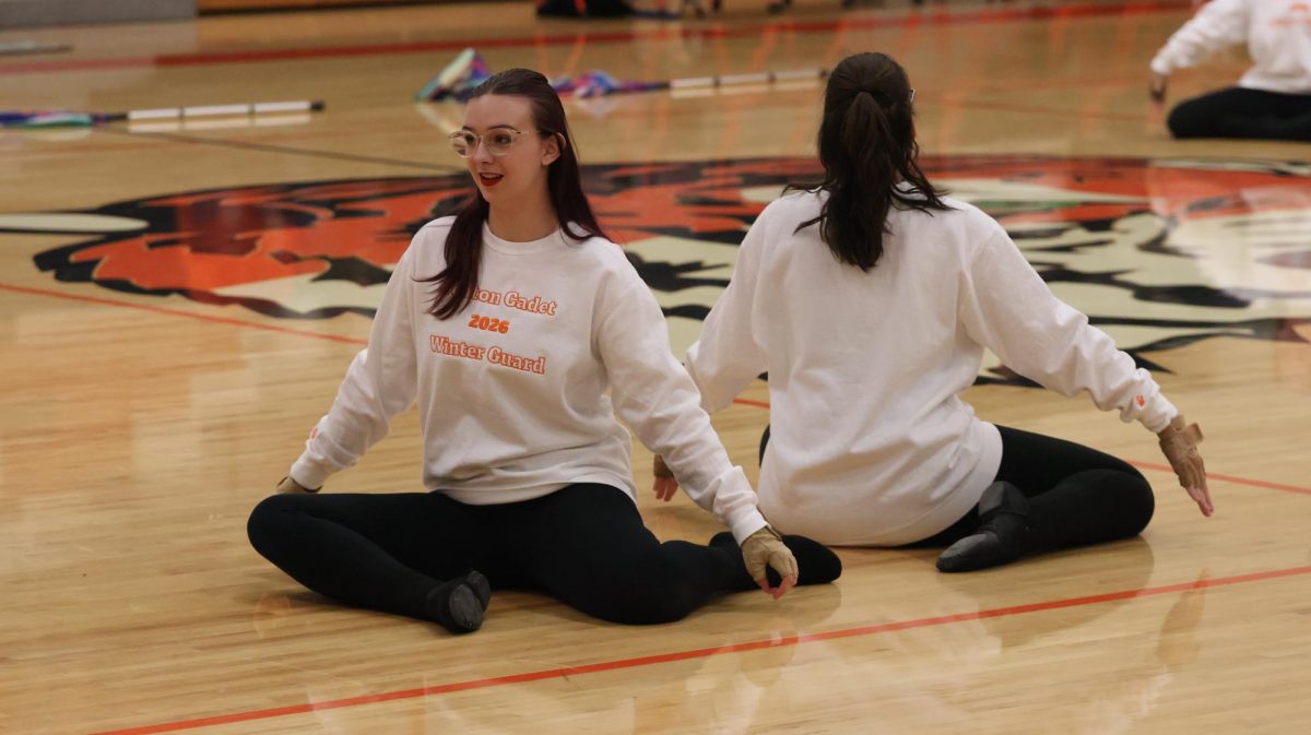 Waiting for the music to begin, sophomore Makayla Novotny performs. On Feb. 13, the FHS winter guard put on their show during the basketball halftime.