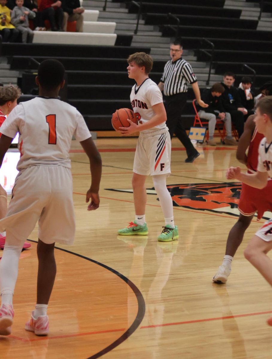 Analyzing the court, freshman Leo McCaughan tries to shoot the ball. On Feb. 9, the boys' freshman basketball team lost 54-28 to Linden.