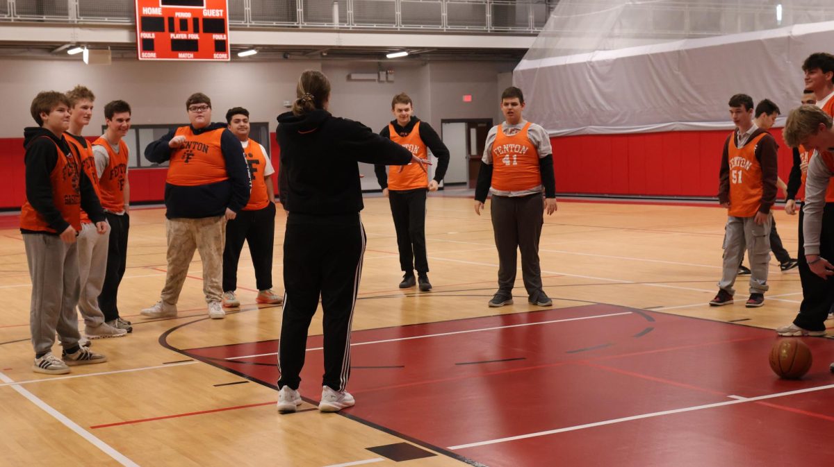 Directing the kids, Coach Tyrrell explains how to play basketball to the unified team. On Jan 30 fentons unified basketball team played lindens team. 
