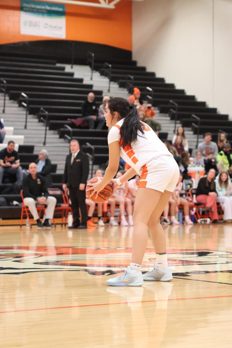 Planning where to take the ball, sophomore Alejandra Ayotte prepers to pass the ball. On Jan 27, the tigers played Lake Fenton and won 

