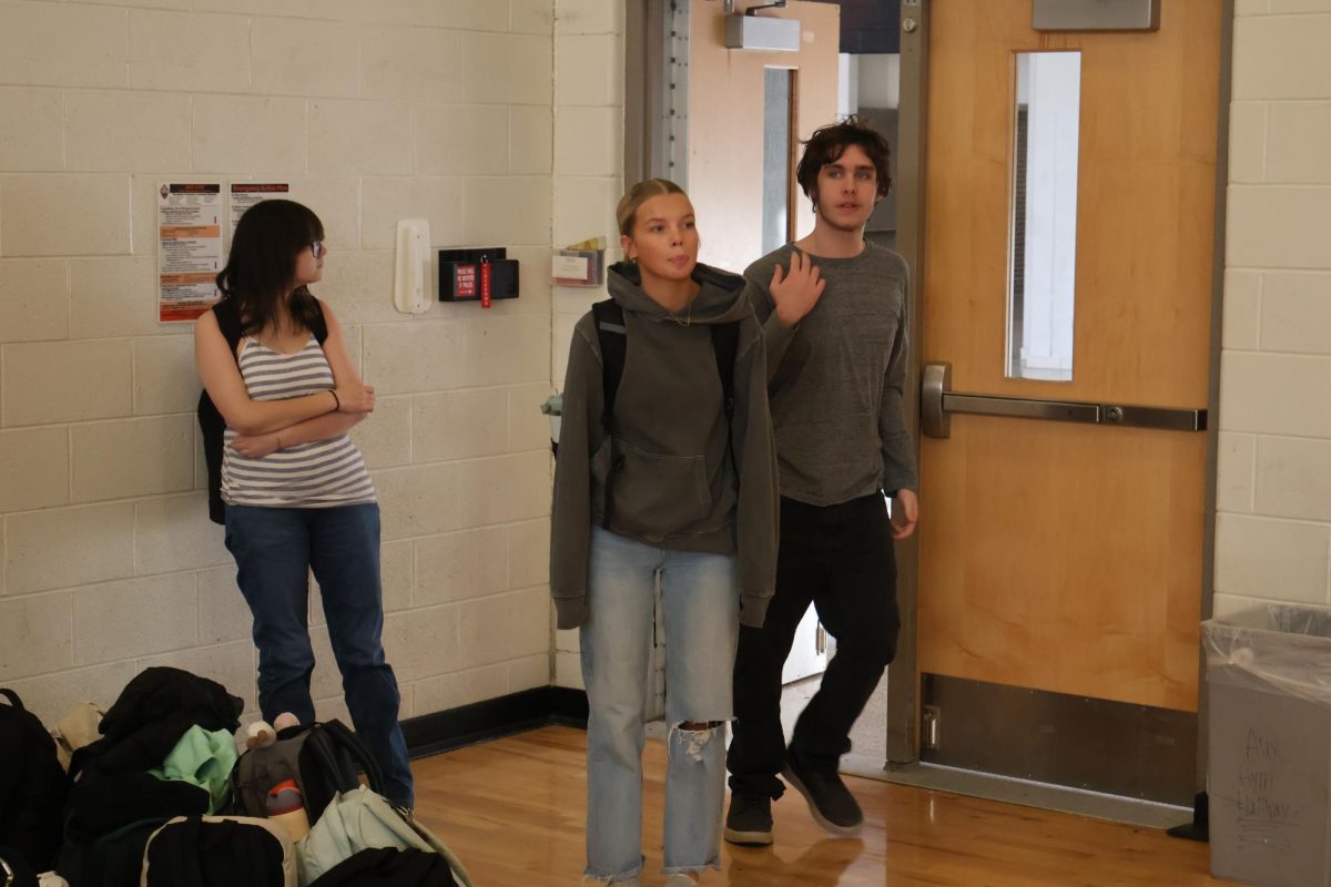 Walking into the gym, Senior Kallyn Sprague is taking her NHS picture. On Jan. 6, club photos took place.  

