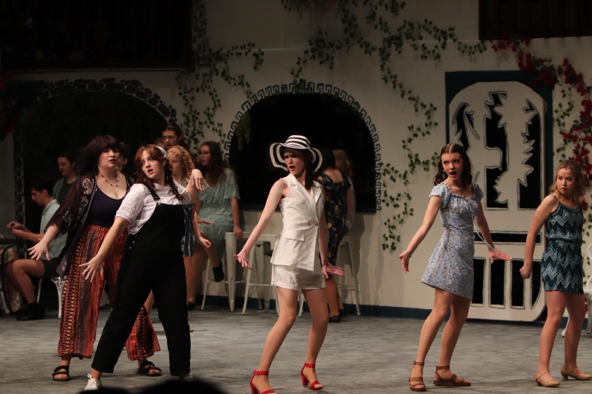Dancing on stage, the Mama Mia cast performs. On Feb. 5, the Fenton Theater Department held the play "Mamma Mia".