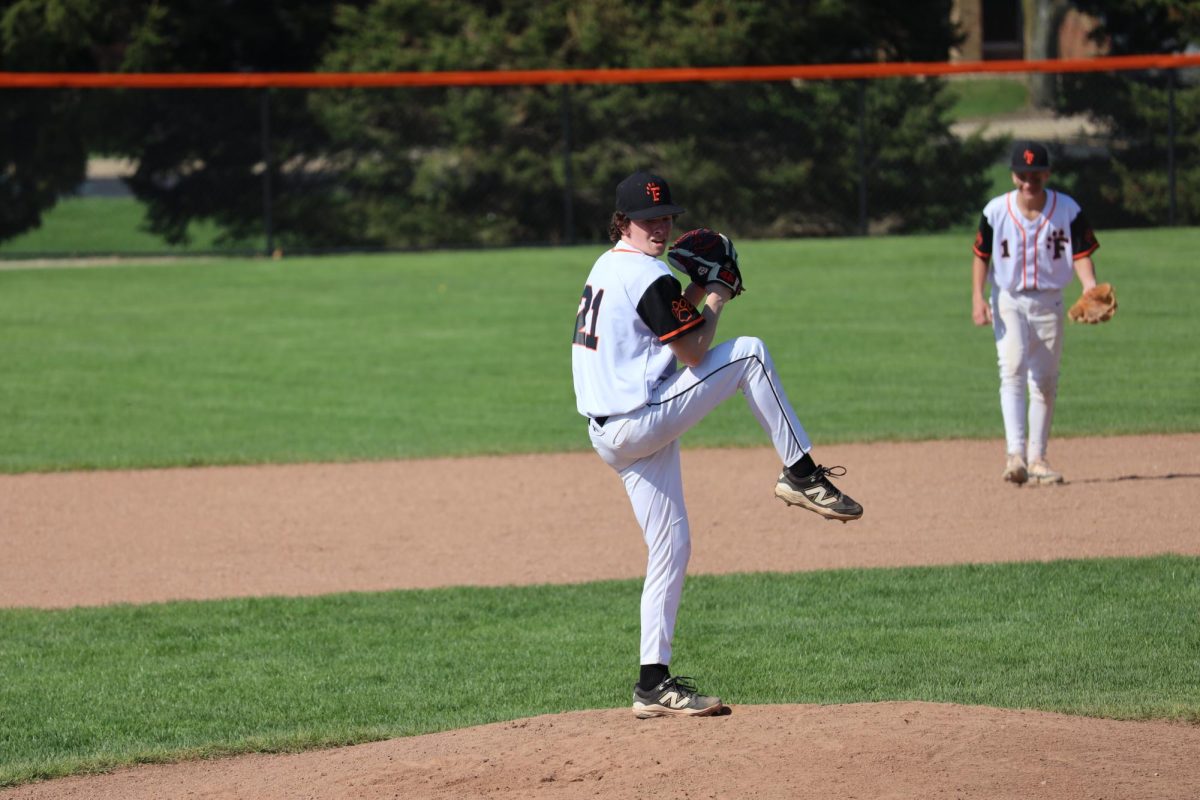 Winding up, Sophomore Lucas Jennings gets ready to pitch. On April 22, Fenton JV black baseball goes against Linden and wins 10-2. 