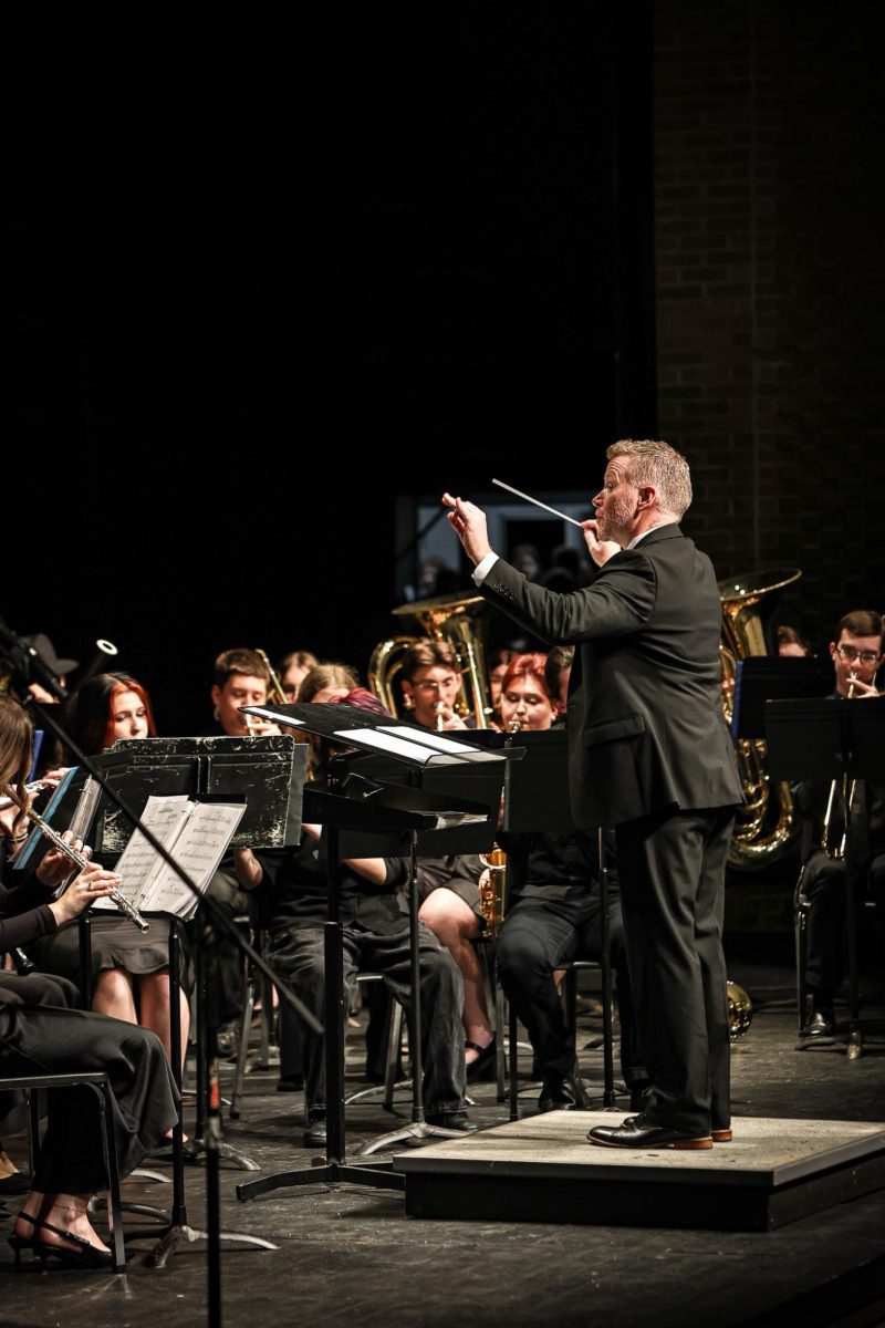 Conducting the band, Patrick Conaton leads the concert. On April 15, the band preforms the Spring Concert in the auditorium.  
