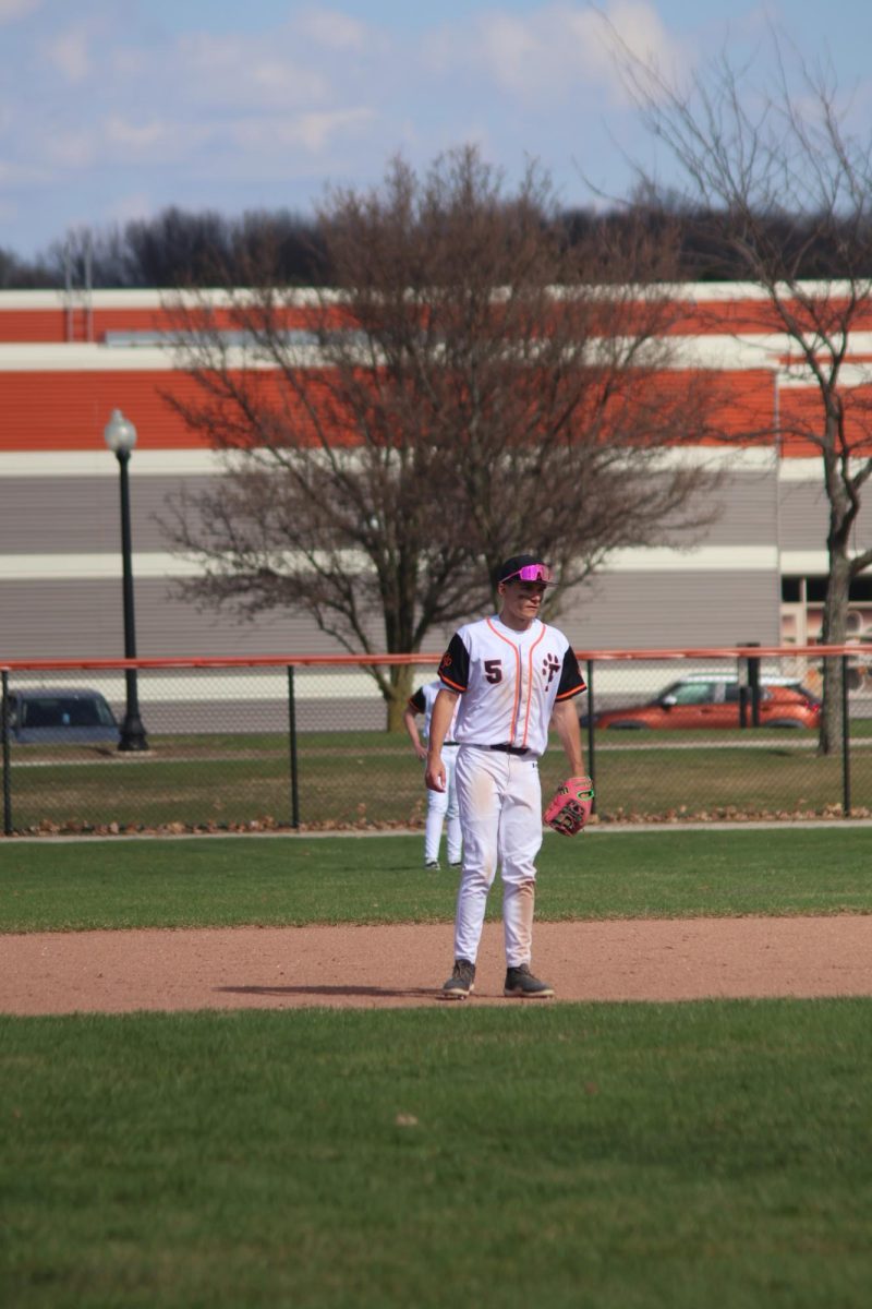 Paying attention, sophomore Carson Bender has locked his eyes on the ball. On April 8, Fenton's JV Black Baseball team won 11-8.
