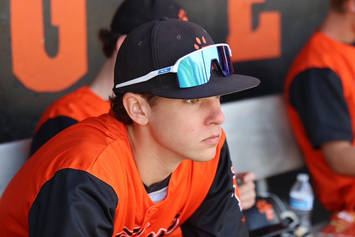 Looking at the field, senior Owen O'Keefe is watching his teammates hit to try and raise money. On April 12, the fenton tigers varsity team had a Hit-A-Thon.