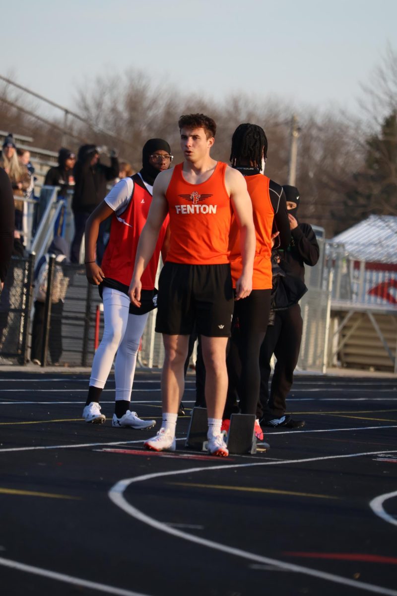 Preparing for his race, Senior Adrian Habel runs the 200-meter dash. On April 9, the Fenton boys' track team beat Swartz Creek 71-65.