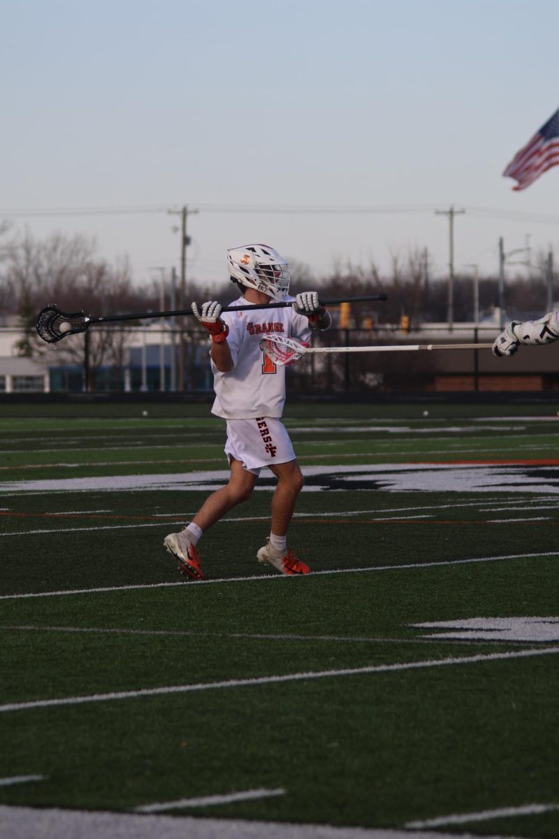 Getting ready to throw the ball, senior Calvin Szafranski is getting ready to pass the ball. On April 11, Fenton Boys Lacrosse played Waterford with a loss of 8-3
