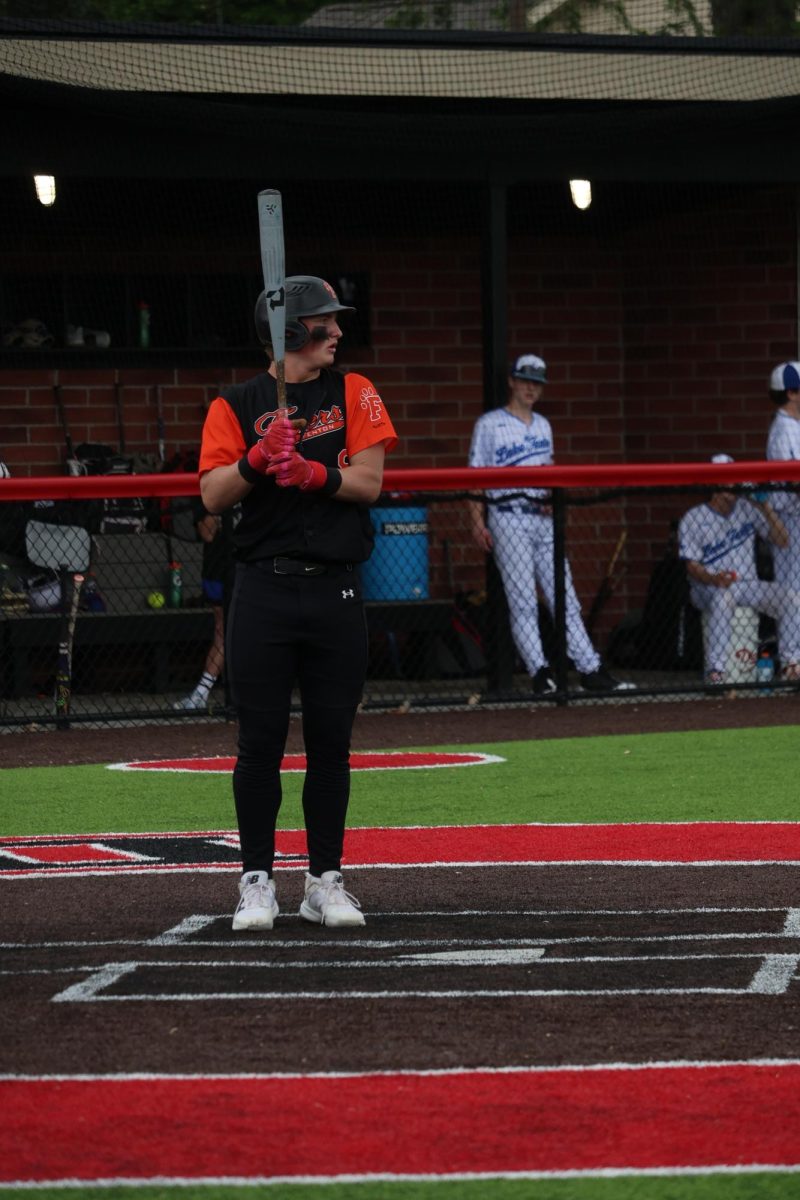Focusing on the next pitch, Senior Noah Sheil waits on the field for the next pitch to come. On May 19, Fenton won against Lake Fenton 16 to 5 in the Metro League Championship.