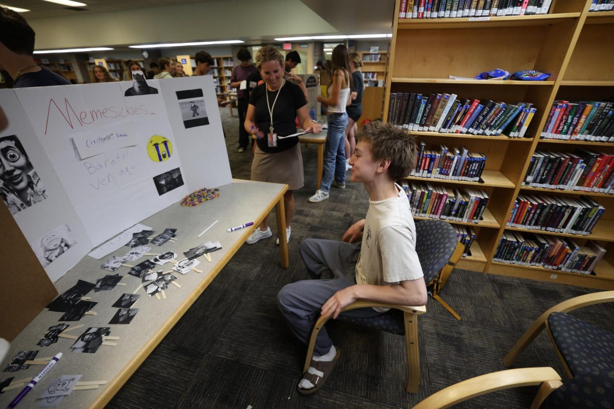 Being complimented by the teacher, sophomore Aiden Pescerolo participates in the Spanish Market Day. On May 18, Spanish teachers Hillary Fischer and Nicole Smiles host a Spanish market for their students. 
