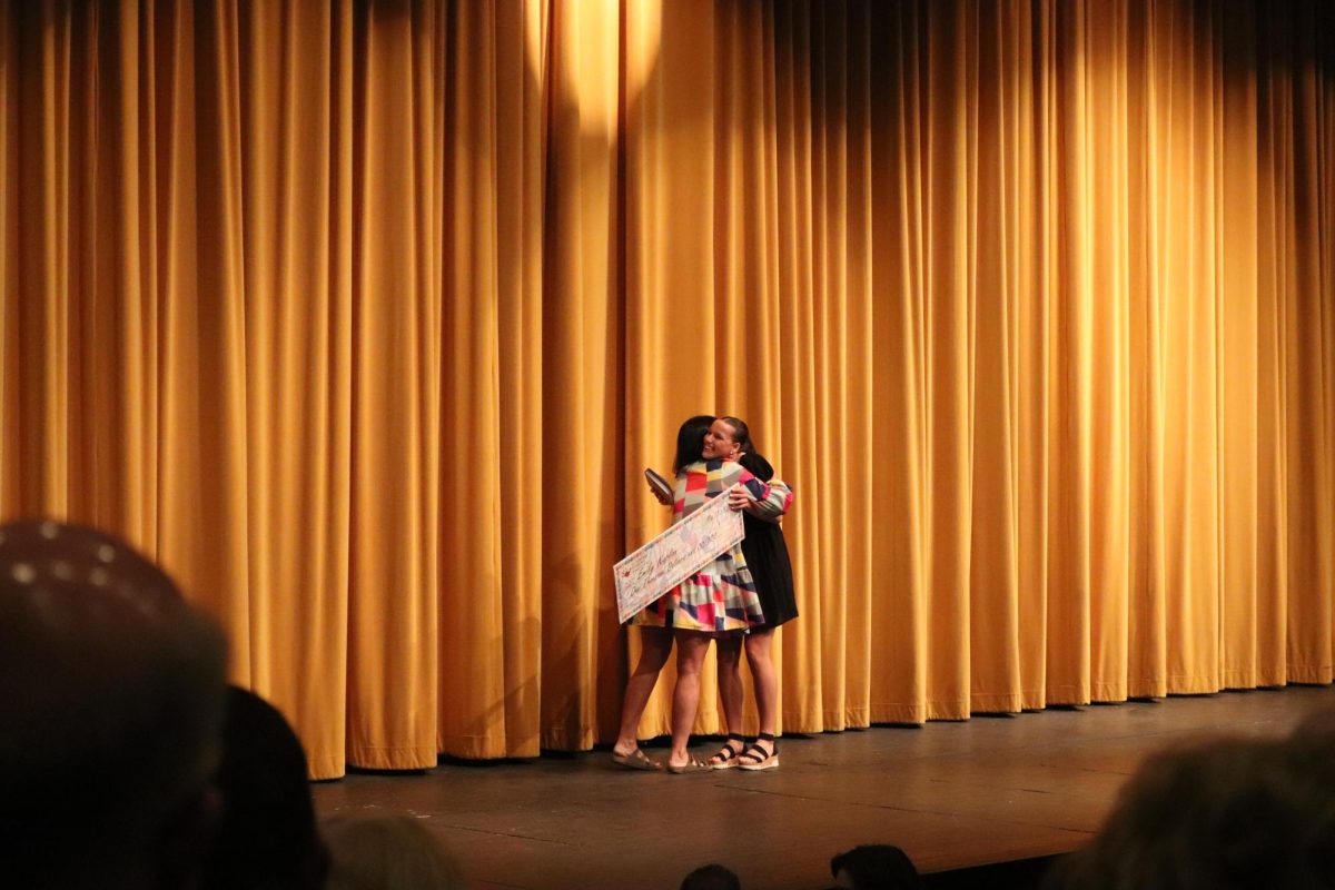 Celebrating after receiving her award, senior Emily Kaplan hugs her sponsor in gratitude. On May 11, Fenton High School holds scholarship awards in the auditorium for seniors. 
