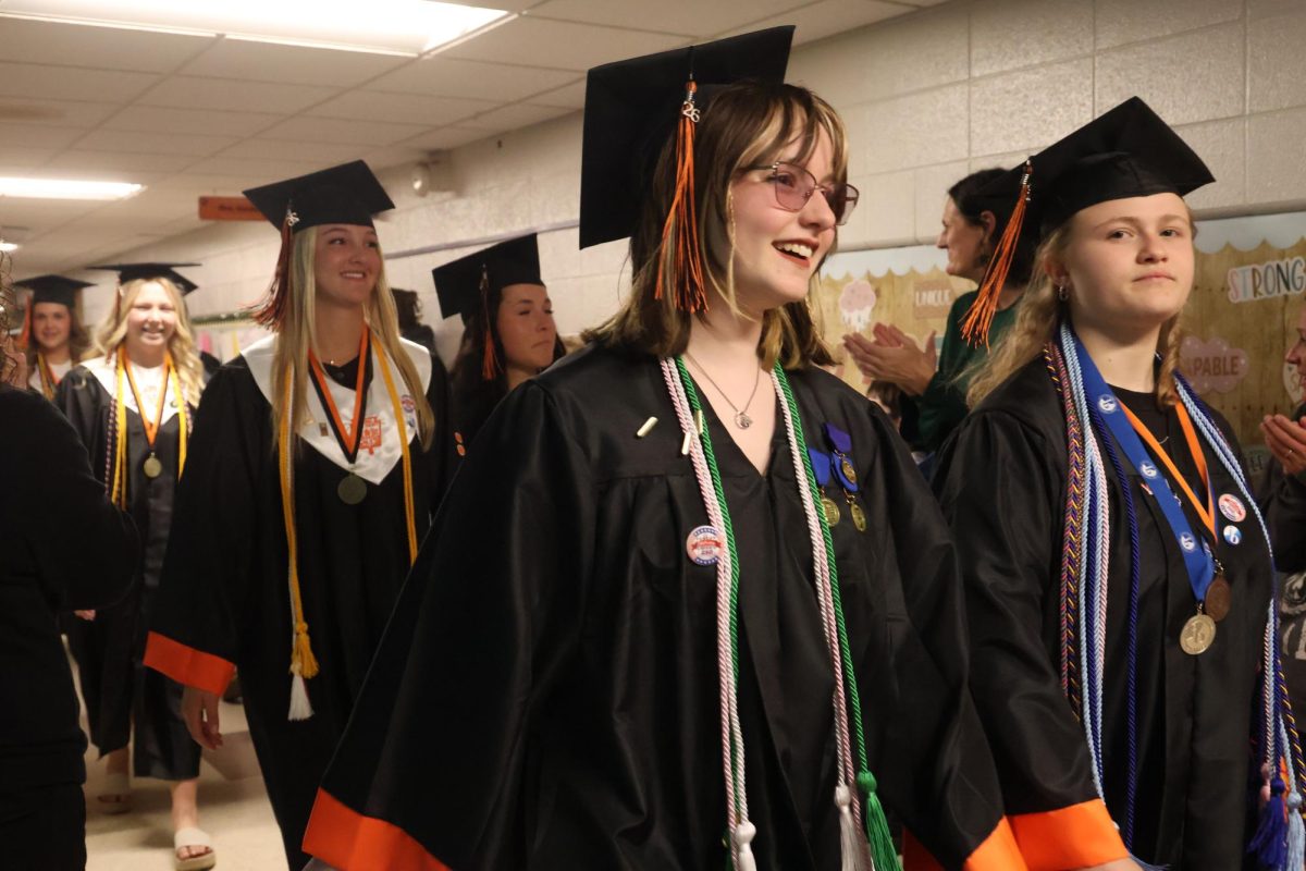 Walking, senior Julia Martin does her last walk through of her old elementary school. On May 14, the senior class celebrates their graduation by walking through their old elementary schools. 
