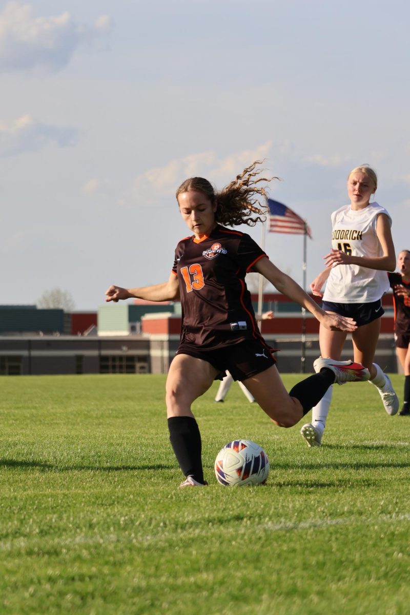 Preparing to kick the ball, freshman Tessa Simoni clears the ball up the field. On May 4, the varsity girls' soccer team played Goodrich and lost 0-4. 