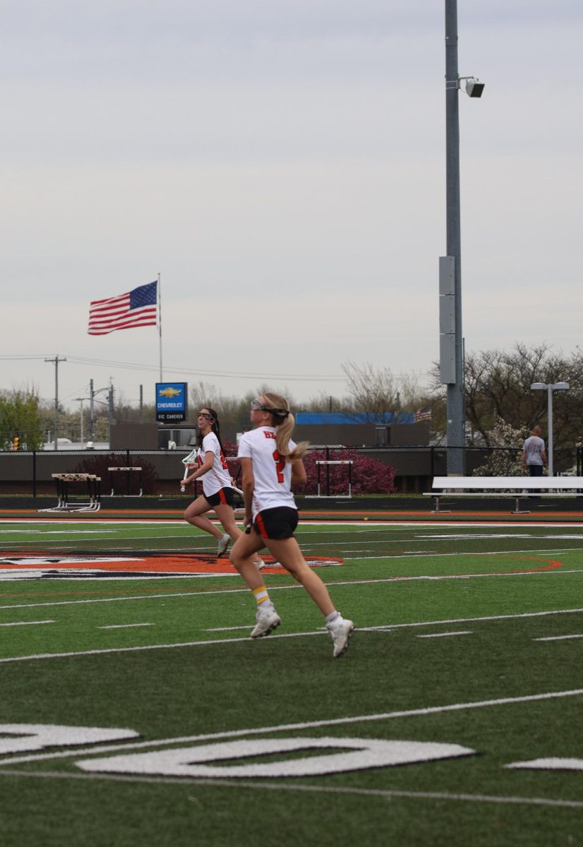 Running for the ball, senior Kallyn Sprague runs down the field. On April 27, the Fenton-Linden Heat Lacrosse team had a game against Swartz Creek.