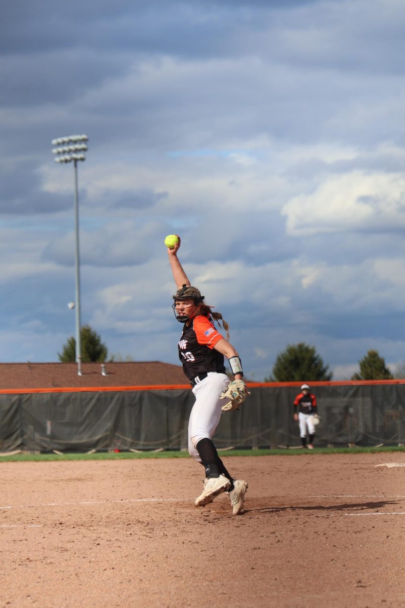 Pitching the ball, junior Lillian Tiller delivers a pitch. On April 4, the fenton girls' Varsity Softball team had a game against Lake Fenton